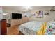 Spacious primary bedroom with hardwood floors and ample closet space at 6589 W Louisiana Pl, Lakewood, CO 80232