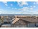 Aerial view of houses and distant mountains at 16325 Spanish Peak Way, Broomfield, CO 80023