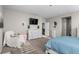 Bedroom with dresser, comfy chair, and lots of natural light at 16325 Spanish Peak Way, Broomfield, CO 80023