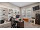 Home office features built-in shelving and window views at 16325 Spanish Peak Way, Broomfield, CO 80023