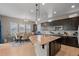 Open concept kitchen with granite island, breakfast nook, and hardwood floors at 16325 Spanish Peak Way, Broomfield, CO 80023