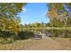 Serene community pond with a bench overlooking the water at 16325 Spanish Peak Way, Broomfield, CO 80023