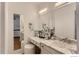 Bathroom boasts a marble vanity and updated fixtures at 3212 S Oneida Way, Denver, CO 80224