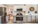 Modern kitchen with stainless steel appliances and stylish cabinetry at 5256 S Ukraine St, Aurora, CO 80015