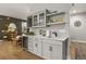 Stylish wet bar with wine storage, sink, and cabinetry at 540 Scrubjay Trl, Castle Rock, CO 80104