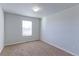 Bright bedroom with neutral walls and carpet at 1221 Bistre St, Longmont, CO 80501