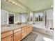 Double vanity bathroom with soaking tub and walk-in shower at 9609 Golden Eagle Dr, Highlands Ranch, CO 80129