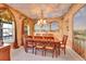 Formal dining room with painted murals, chandelier, and wood table set at 9609 Golden Eagle Dr, Highlands Ranch, CO 80129