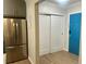 Modern entryway with new flooring, closet, and blue door at 320 S Ames St # 5, Lakewood, CO 80226