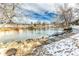Community with a partially frozen pond and walking path at 309 E Highline Cir # 101, Centennial, CO 80122