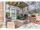 Private patio with seating area, grill, and winter decorations at 309 E Highline Cir # 101, Centennial, CO 80122
