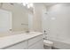 Clean bathroom featuring white vanity, shower and tub combo, and tile flooring at 455 Interlocken Blvd # 102, Broomfield, CO 80021