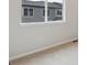 Simple bedroom with carpeted flooring and a window with neighborhood views at 455 Interlocken Blvd # 102, Broomfield, CO 80021