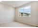 Empty bedroom with neutral walls, carpet, and large windows at 455 Interlocken Blvd # 102, Broomfield, CO 80021