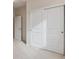 Bedroom closet with sliding double doors and carpeted flooring at 455 Interlocken Blvd # 102, Broomfield, CO 80021