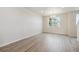 Bright dining room with wood-look flooring and large window at 455 Interlocken Blvd # 102, Broomfield, CO 80021