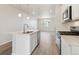 Another view of the kitchen highlighting the open layout and connection to the dining area at 455 Interlocken Blvd # 102, Broomfield, CO 80021