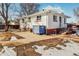 Side view of a ranch home with a concrete patio at 2200 W Moffat Pl, Denver, CO 80221