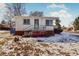 Ranch-style home with brick accents and a small front yard at 2200 W Moffat Pl, Denver, CO 80221
