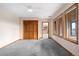 Spacious bedroom with wood closet doors and window views at 5378 Hawthorn Trl, Littleton, CO 80125