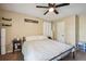 King-size bedroom featuring a ceiling fan and ample closet space at 2118 S Truckee St, Aurora, CO 80013