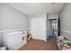 Second bedroom with double-door closet and adjacent hallway at 2118 S Truckee St, Aurora, CO 80013