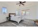 Spacious bedroom with ceiling fan and ample natural light at 15505 Carob Cir, Parker, CO 80134