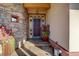 Front entry with stone and stucco exterior, and a unique door at 1919 3Rd Ave, Longmont, CO 80501