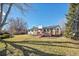 Large backyard with deck, shed, and mature trees at 10610 W Saratoga Pl, Littleton, CO 80127