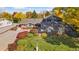 Aerial view of a two-story home with a large yard at 6030 Fox Hill Dr, Longmont, CO 80504