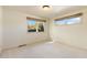 Simple bedroom with neutral colored walls and carpet at 6030 Fox Hill Dr, Longmont, CO 80504