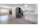 Open kitchen featuring stainless steel appliances and white cabinetry at 3423 S Vrain St, Denver, CO 80236