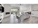 Spacious living room featuring a fireplace, hardwood floors and sliding glass doors at 18352 W 95Th Pl, Arvada, CO 80007