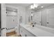 Basement bathroom with modern vanity and walk-in shower at 18352 W 95Th Pl, Arvada, CO 80007