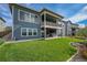 Large backyard with a covered patio, hot tub, and grassy area at 18352 W 95Th Pl, Arvada, CO 80007