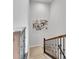 Modern staircase with wood and metal railings at 18352 W 95Th Pl, Arvada, CO 80007