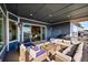 Relaxing covered patio furnished with wicker seating at 18352 W 95Th Pl, Arvada, CO 80007