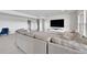Comfortable basement rec room featuring a sectional sofa and large TV at 18352 W 95Th Pl, Arvada, CO 80007