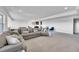 Finished basement with large sectional sofa and wet bar area at 18352 W 95Th Pl, Arvada, CO 80007