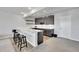 Stylish basement wet bar with dark cabinetry and quartz countertops at 18352 W 95Th Pl, Arvada, CO 80007