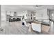 Open concept living space with kitchen and living area at 18352 W 95Th Pl, Arvada, CO 80007