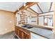 Kitchen with double sink and custom wood cabinetry at 2933 W Short Pl, Denver, CO 80204