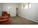 Cozy carpeted bedroom with two armchairs and a closet at 44 N Lincoln St, Denver, CO 80203