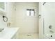 Bathroom with white vanity, bathtub, and tile floor at 44 N Lincoln St, Denver, CO 80203