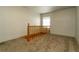 Spacious loft area with carpeted floor and wooden railing at 44 N Lincoln St, Denver, CO 80203