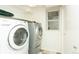 Laundry room with washer, dryer, and shelving at 44 N Lincoln St, Denver, CO 80203
