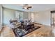 Living room featuring hardwood floors, comfy seating and a coffee table at 17291 E 107Th Ave, Commerce City, CO 80022