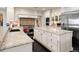 Island kitchen with granite countertops and stainless steel appliances at 29115 Summit Ranch Dr, Golden, CO 80401
