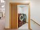 Laundry room with washer, dryer, and built-in shelving at 29115 Summit Ranch Dr, Golden, CO 80401
