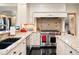 Large kitchen with professional range and granite countertops at 29115 Summit Ranch Dr, Golden, CO 80401